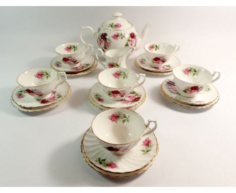 A Royal Kendal floral tea service comprising teapot, six cups and saucers, jug and six tea plates 