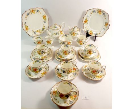 A Royal Albert Edwardian floral tea service comprising two tea pots, milk, jug, sugar, seven cups and eight saucers, slop bow