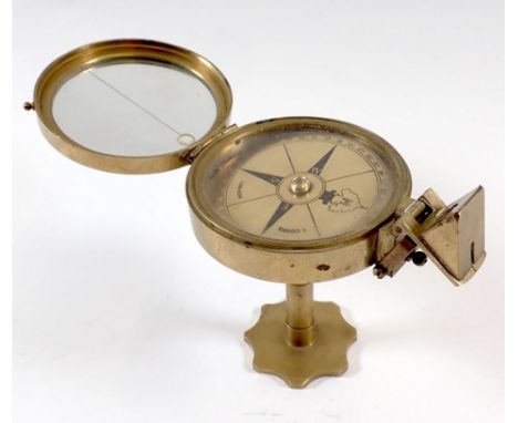 A brass pedestal compass by Stanley 