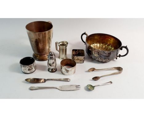 A sterling silver mug 249g, a silver salt and pepper and napkin ring 74g and various silver plated items 