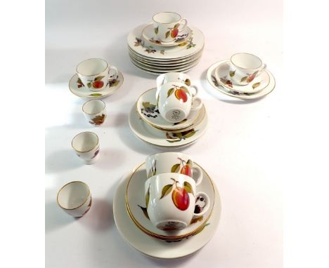A Royal Worcester Evesham tea service comprising seven cups and saucers, five tea plates, seven side plates and three egg cup