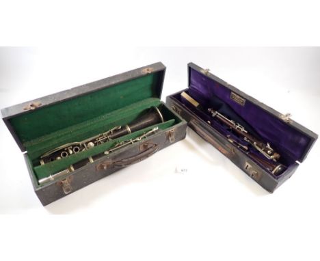 An antique rosewood oboe stamped 'JTL' and a student clarinet - both cased 