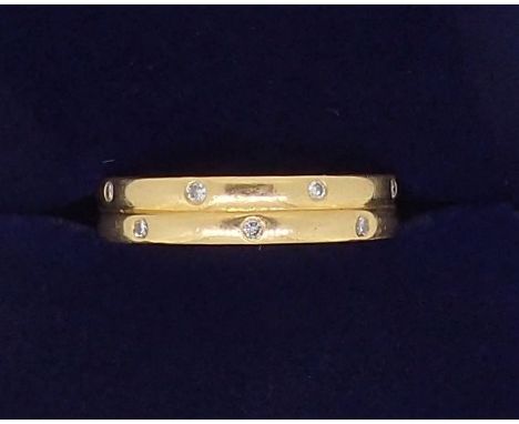 An 18 carat gold ring inset small diamonds, Birmingham 2001 makers mark C, G &amp; S, 4.3g, size K 