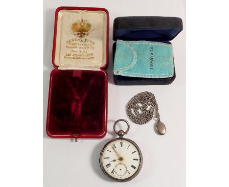 A silver pocket watch, white metal locket, Tiffany box and a Russian jewellery box 