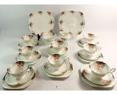 A Shelley vintage tea service decorated fruit comprising eight cups (3 a/f), ten saucers, milk, sugar, ten tea plates and two