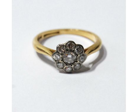 Diamond nine-stone cluster ring, '18ct Platinum'. Condition Report Size M½