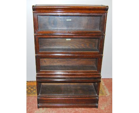 1920s Globe Wernicke oak four-section bookcase, 140cm high and 86cm wide. Condition Report No worm.  One handle missing.  Top