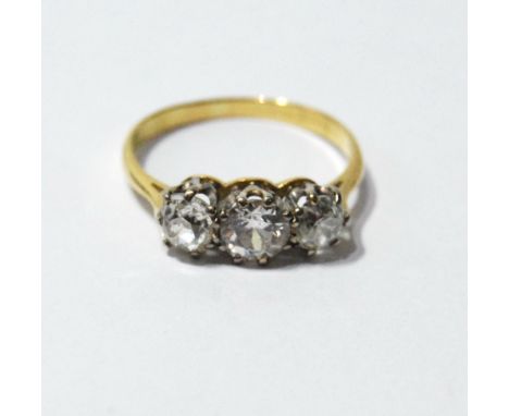 Diamond three-stone ring with old-cut brilliants, approximately .4ct and .6ct, in gold and platinum. Condition Report Size P