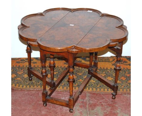 1920s lobed circular walnut gate-leg occasional table, 48cm high and 70cm diameter.