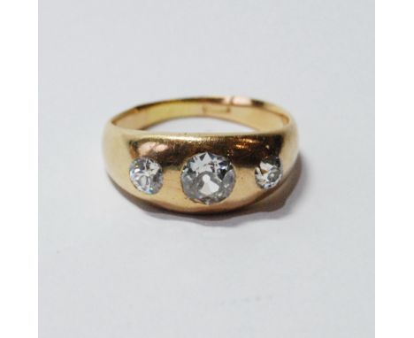 Gent's diamond ring with three old-cut brilliants, approximately 1ct and .4ct, gipsy-set, in gold ,'18ct'. Condition Report S