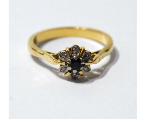 Diamond and sapphire cluster ring, in 18ct gold. Condition Report Size Q.  4.5g