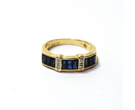 Dress ring with baguette sapphires and diamonds, in gold, '750'. Condition Report Size M