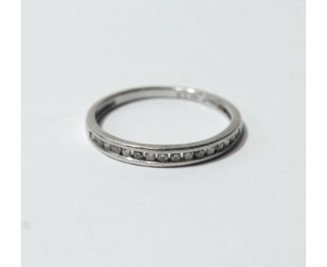 Half eternity ring with channel-set diamond brilliants in 18ct white gold. Condition Report Size O.  Good condition, has been