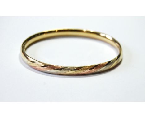Tri-colour 15ct gold bangle with hinged snap fastening, '585'. Condition Report 13.3g