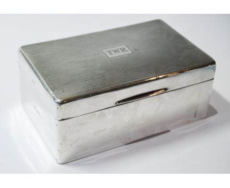 Silver cigarette box, engine-turned, 1939.