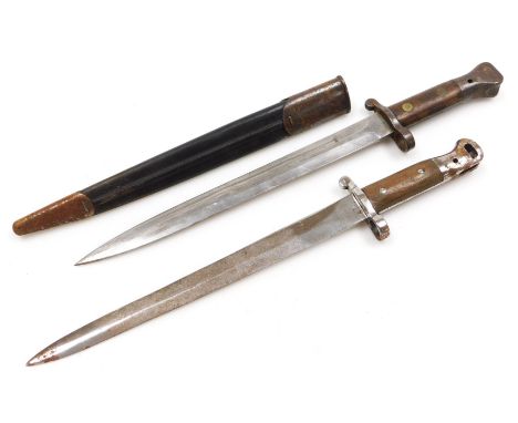 A British Army 1903 pattern SMLE bayonet by Wilkinson, the 29cm double edge blade stamped Wilkinson London to the ricasso and