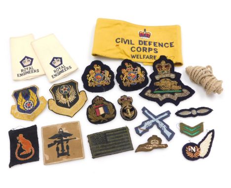 A collection of military cloth badges, including Royal Naval gold braid insignia, 8th Army Desert Rat, Royal Engineers epaule