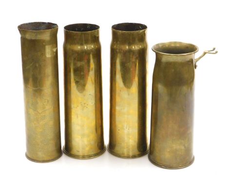 A WWI and WWII brass ordnance shells, one with trench art engraving initialled BS, two further WWI 13 Pdr shell cases, and a 