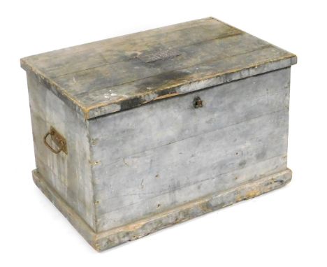 A Victorian pine trunk, the interior with two fitted upper trays, and divisions below, the hinged lid bearing a brass plaque 
