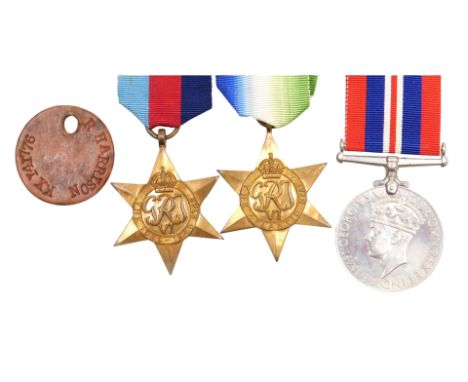A WWII medal group, comprising 1939-45 British War medal, Atlantic Star and 1939-45 Star, with ID tag, inscribed to KX141776 