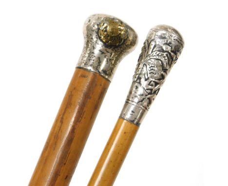 A malacca swagger stick with white metal terminal and Royal Flying Corps crest, another malacca long slender swagger stick wi