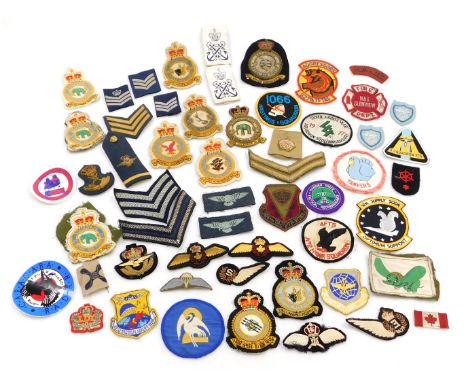 A collection of military cloth badges, insignia and epaulettes. (1 bag) 