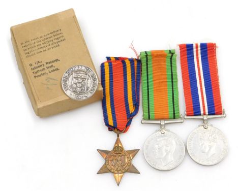 A WWII medal group, comprising 1939-45 British War medal, The Burma Star and Defence medal, together with Royal Ordnance Fact