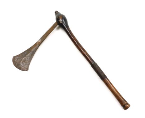 An African tribal war axe, possible a Chokwe, with steel blade 29cm, and natural tapered wooden shaft with turned terminal an