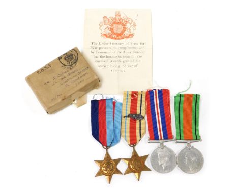 A WWII medal group, comprising 1939-45 British War medal, the 1939-45 Star, Africa Star with oak leaf insignia (MID) and Defe