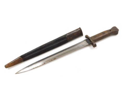 A British Army 1903 pattern SMLE bayonet by Wilkinson, the 29cm double edge blade stamped Wilkinson London to the ricasso and
