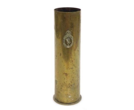 A German WWI brass ordnance shell, with the regimental crest of the Royal Corps of Signals, 27.5cm high.