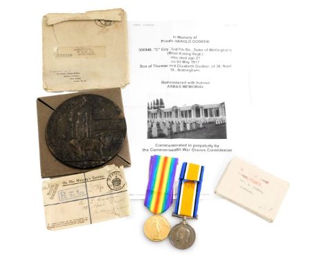 A WWI bronze death plaque and medal pair, the death plaque named to Harold Godber, and the medals inscribed to 306984 Pte H G