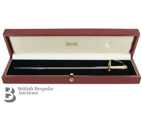 Wilkinson Sword miniature sword in presentation box, with plaque engraved 'To commemorate the presentation of the Sword of Pe