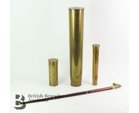 Tall shell casing - umbrella stand, approx 68 cms containing a walking stick with a horse-head handle which unscrews to revea