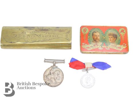 Circa 1911 Cadbury Bournville chocolate tin, containing a WWI medal to: Lieut. B Boyce together with a George V commemorative