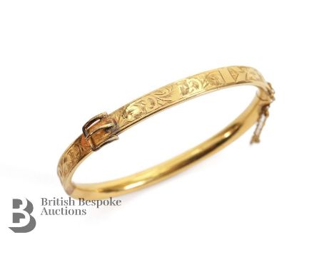 Edwardian 14/15ct heavy gold plated buckle bangle. The bangle measures approx 16 cms circumference, approx 16.8 gms.&nbsp;