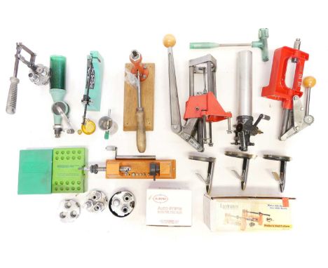 Large collection of reloading tools, to include a Lee Turret press, a single stage press, four priming tools, RCBS scales, an