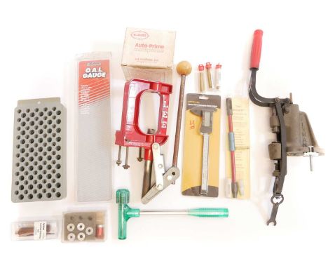 Mixed reloading tools, to include a Lyman lubsizer, Lee single stage press, bullet puller hammer, bore gauge, flash hole unif