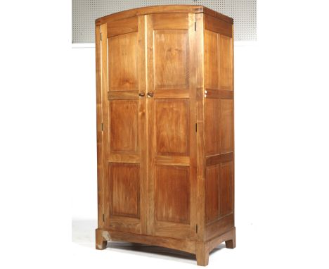 English walnut two-door wardrobe, probably Peter Waals design Arts &amp; Crafts Cotswold School. With two, six panelled doors