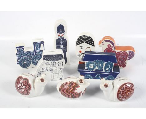 Nine Carlton Ware ceramic money boxes. Comprising a red pony, Noah's Arc, Train, Policeman, Monocle, Old Woman who lived in a