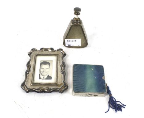A Victorian silver picture frame, silver plated perfume bottle and  a contemporary Moxo compact. The picture frame marked Bir