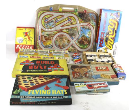 An assortment of vintage toys and games. Including Flying Hats, friction vehicles, Chad Valley 'Beetle Game', etc. the majori