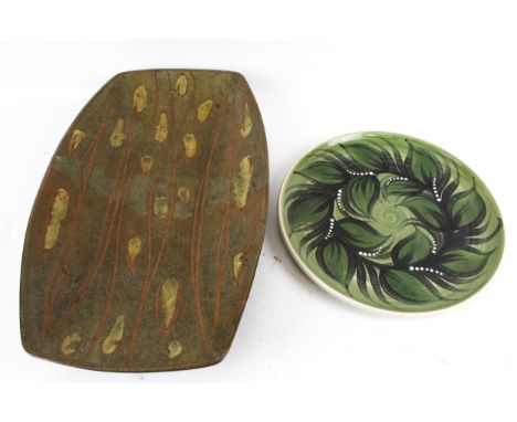 Two vintage Studio Art Pottery items. Including a plate with leaf decoration signed to the base, diameter 28cm, and a rectang