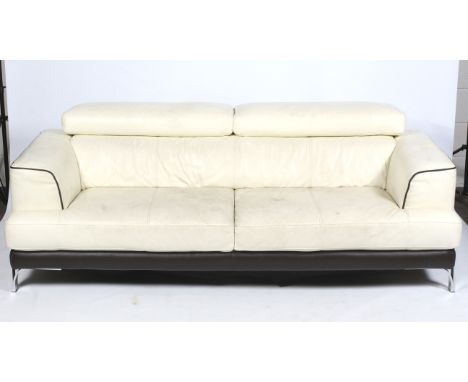 A contemporary cream leather three seater sofa. L213cm x D96cm x H74cm