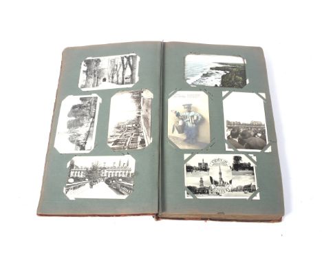 An album of vintage postcards. Mostly featuring British locations, including Edinburgh, Ross Castle, etc.