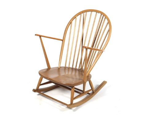 A mid-century Ercol bentwood rocking chair. H95cm Condition Report: Appears in a fair condition, light surface scratches and 