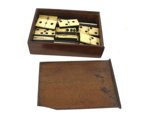 A set of twenty-eight vintage bone dominoes. Within a wooden box, L16.5cm