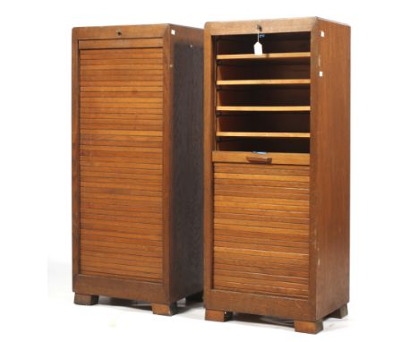 A pair of mid-century vintage oak tambor front multi drawer filing cabinets. L46cm x D36cm x H115cm Condition Report: In a fa