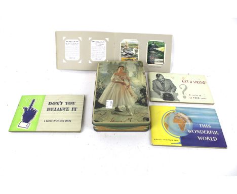 Four books of vintage TREX collectors cards. Including a set of 'How...What...& Why', 'Isn't It Strange', etc.