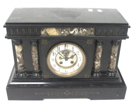 A substantial Victorian black slate and marble mantel clock. With architectural features, a white enamel dial, Arabic numeral